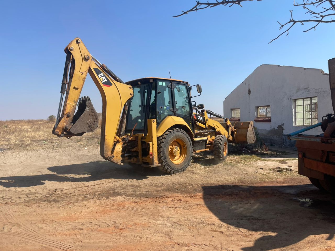 Backhoe loader on site