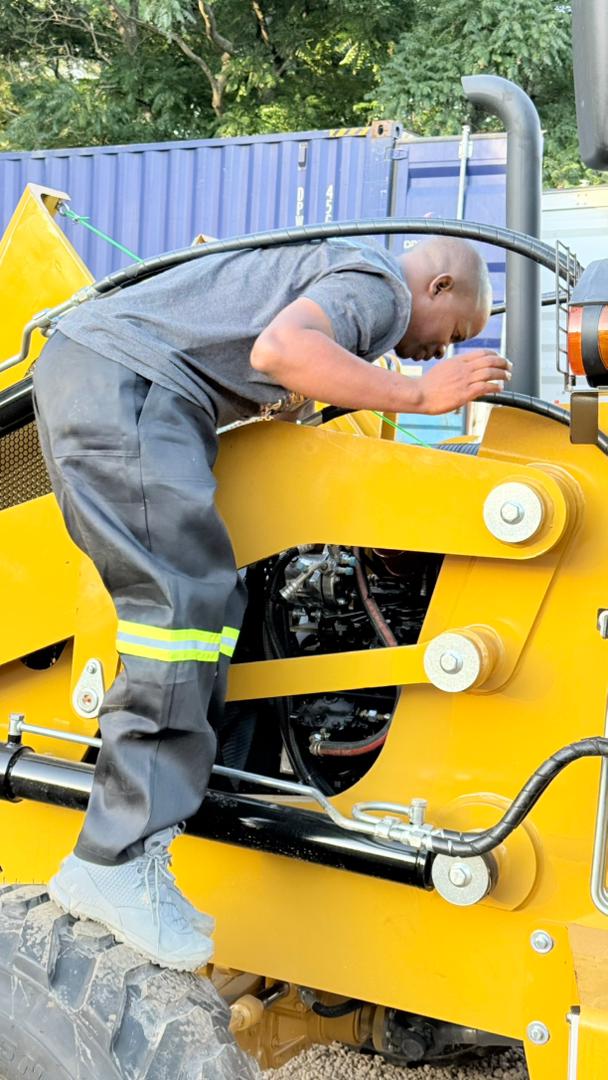 Construction and QA/QC — crew inspecting equipment on site